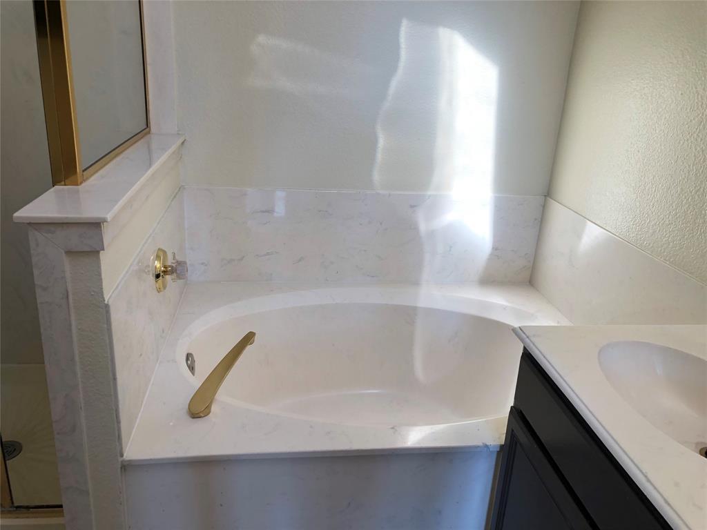10350 Hampton Court Frisco, TX 75035 - Photo 15 of 27 a bathroom with a tub