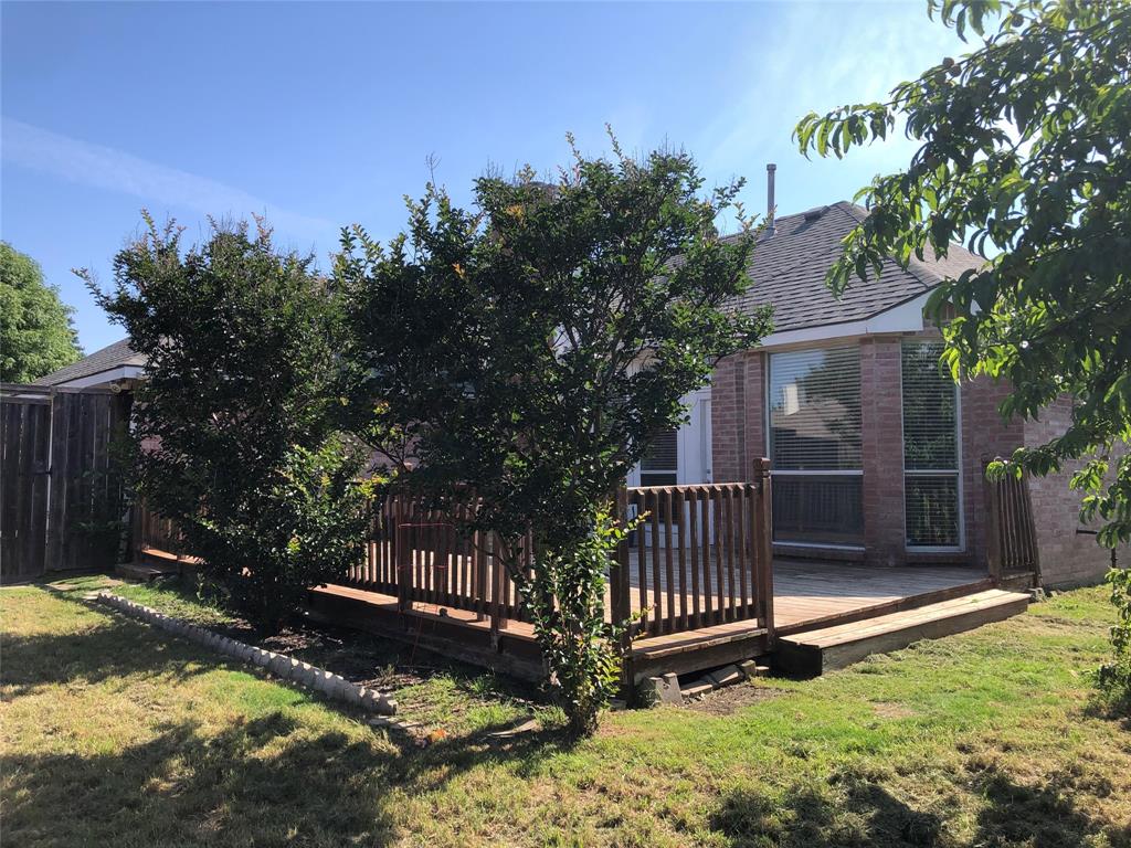10350 Hampton Court Frisco, TX 75035 - Photo 24 of 27 a front view of a house with a yard