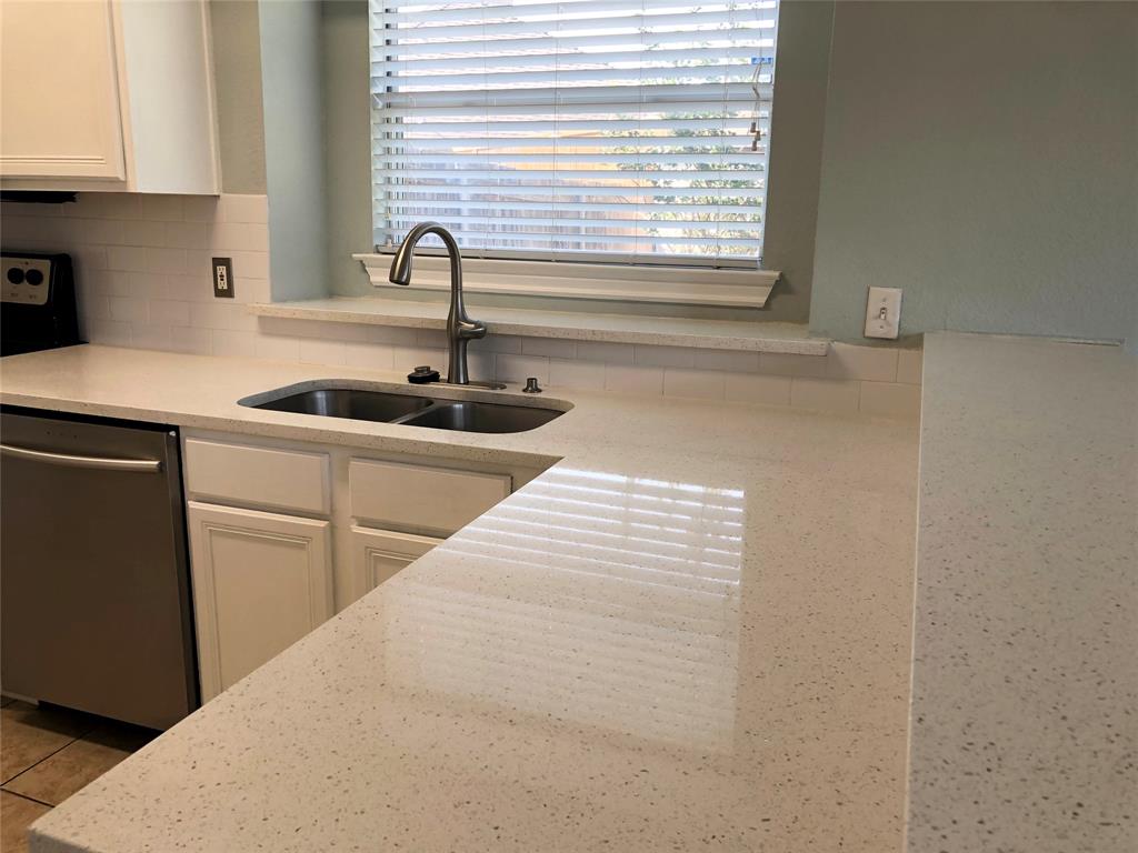 10350 Hampton Court Frisco, TX 75035 - Photo 8 of 27 a kitchen with a sink and wooden floor