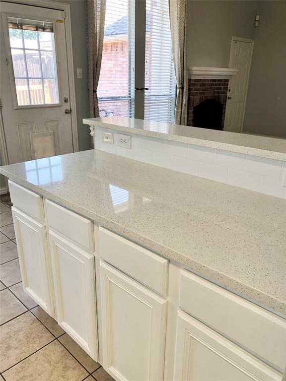 10350 Hampton Court Frisco, TX 75035 - Photo 9 of 27 a kitchen with a sink and a window