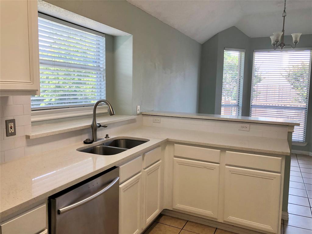 10350 Hampton Court Frisco, TX 75035 - Photo 10 of 27 a kitchen with a sink and wooden floor