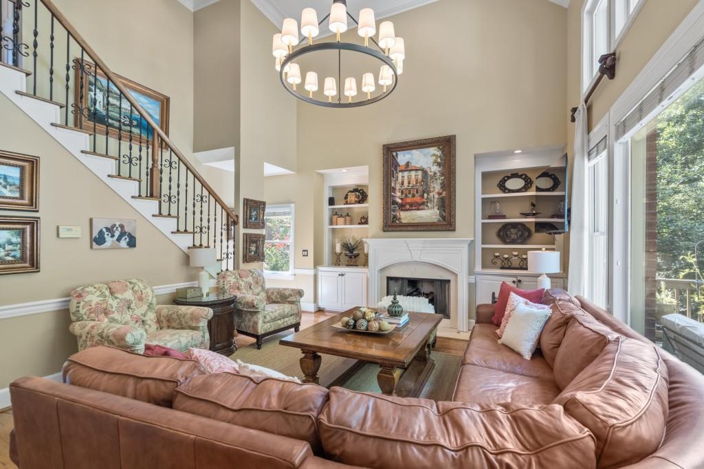 4140 River Bluff Run Way Suwanee, GA 30024 - Photo 15 of 83 a living room with furniture fireplace and a large window