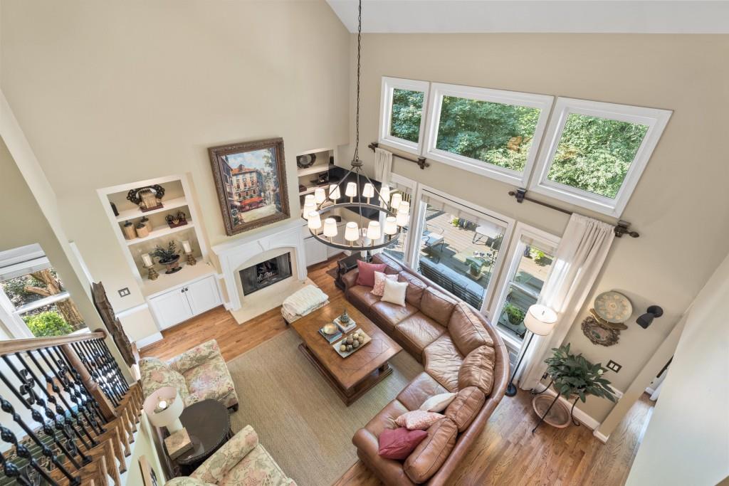 4140 River Bluff Run Way Suwanee, GA 30024 - Photo 21 of 83 a living room with furniture and a floor to ceiling window