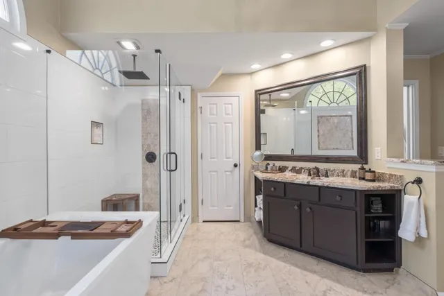 a living room with furniture a bed and a window