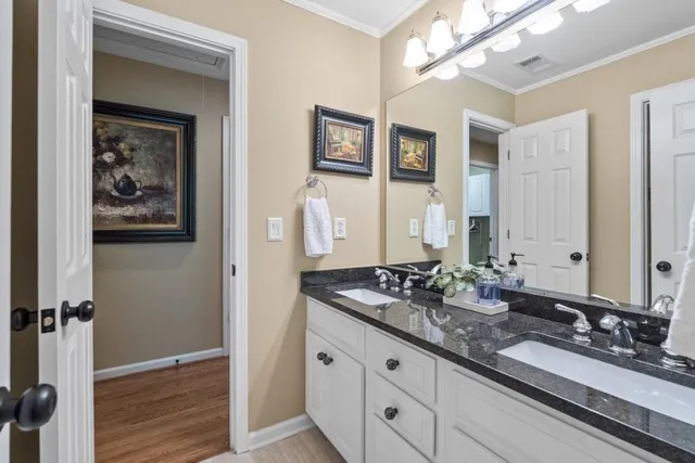 a view of balcony with couches and wooden floor