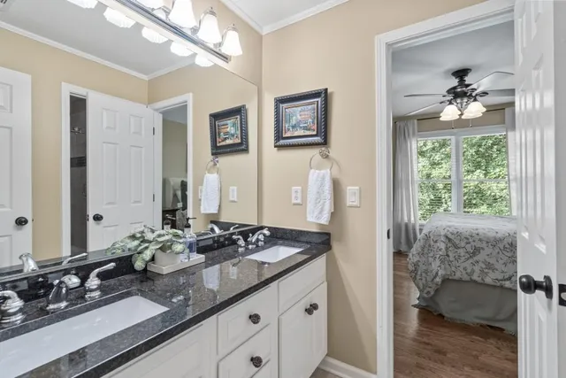 a view of a patio with table and chairs and wooden floor