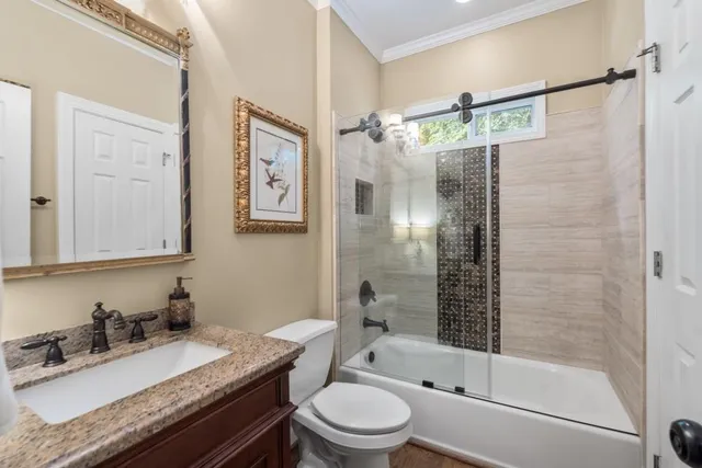 a view of backyard with plants and outdoor seating