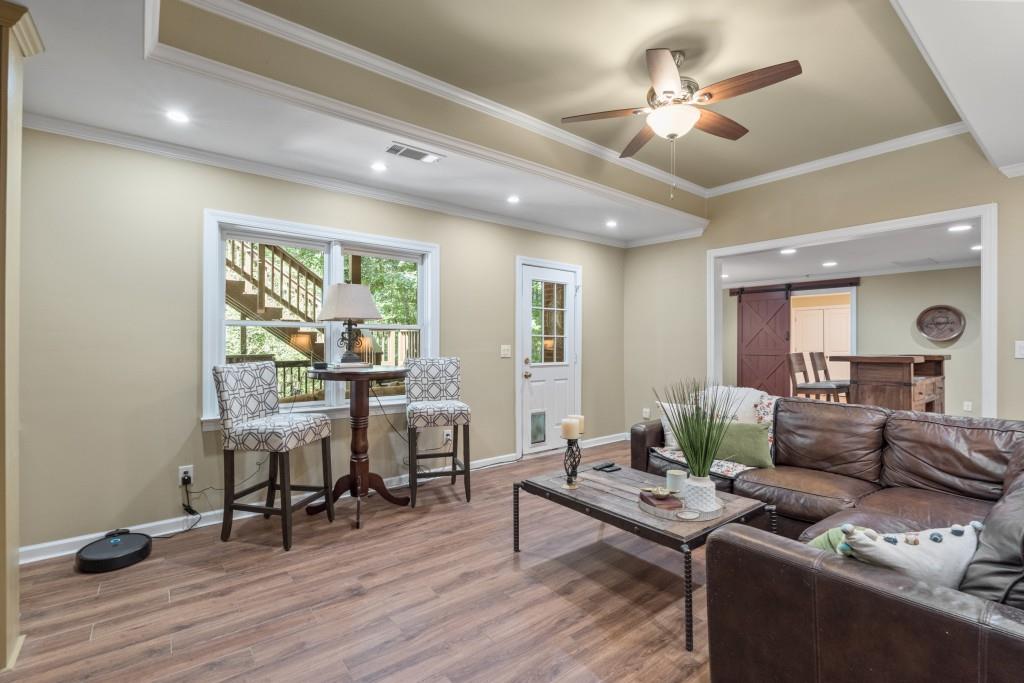 4140 River Bluff Run Way Suwanee, GA 30024 - Photo 44 of 83 a living room with furniture and wooden floor