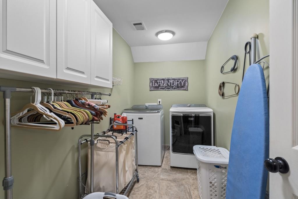 4140 River Bluff Run Way Suwanee, GA 30024 - Photo 47 of 83 a view of walk in closet with clothes and shoes