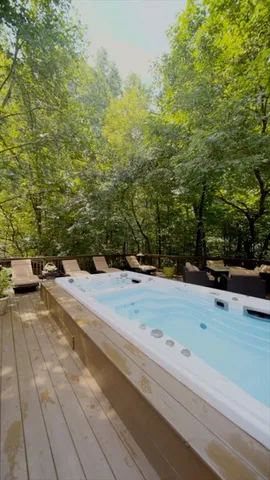 an aerial view of a residential houses with yard