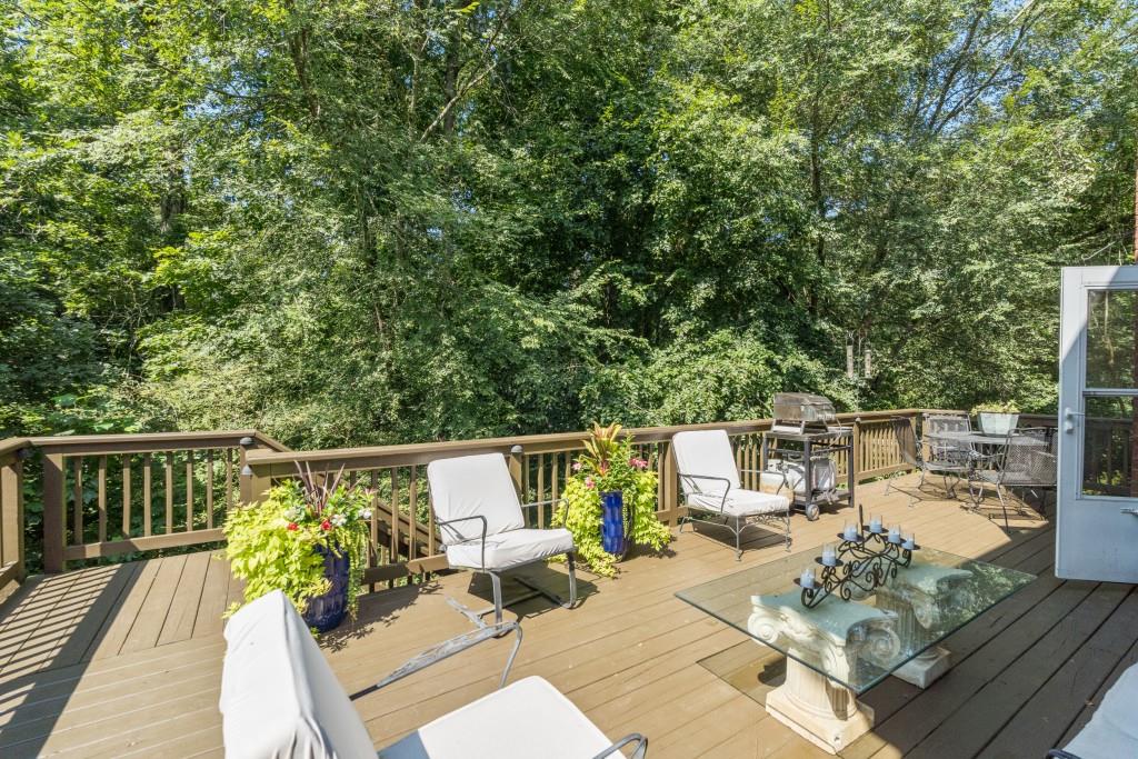 4140 River Bluff Run Way Suwanee, GA 30024 - Photo 52 of 83 a view of balcony with furniture and wooden floor