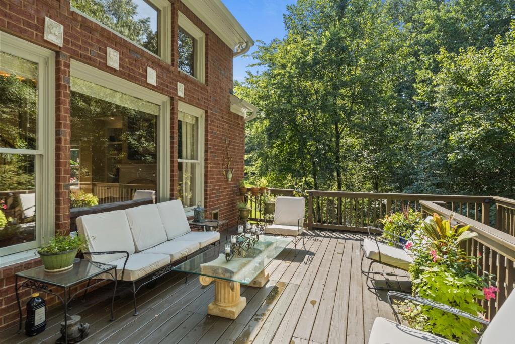 4140 River Bluff Run Way Suwanee, GA 30024 - Photo 53 of 83 a view of balcony with couches and wooden floor