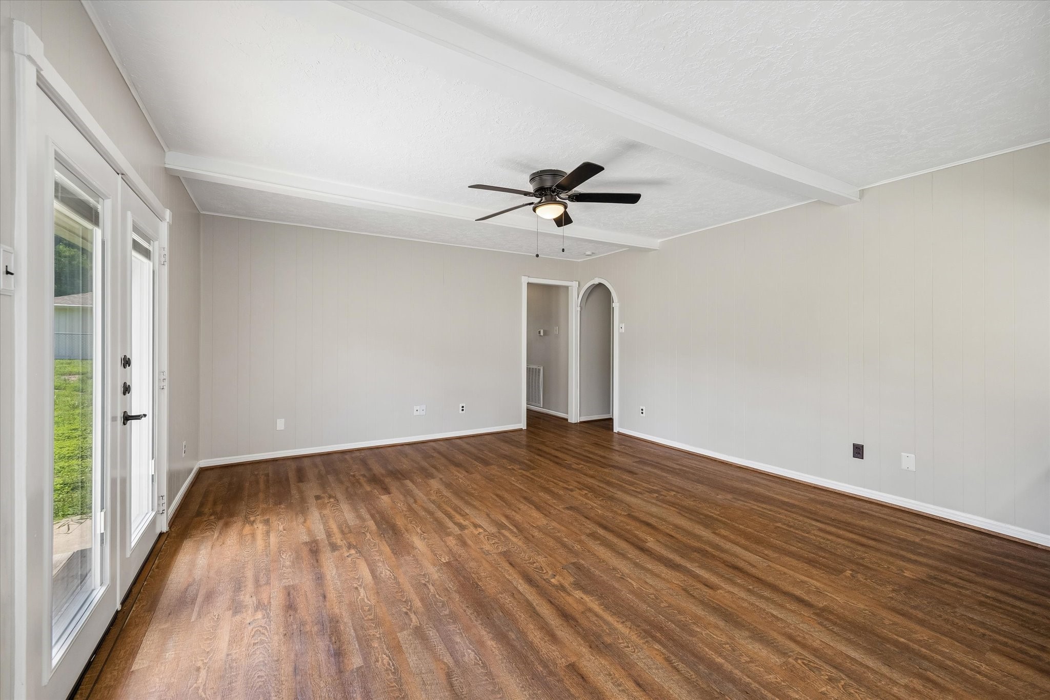 25114 Spring Ridge Drive Spring, TX 77386 - Photo 7 of 24 wooden floor in an empty room with a window