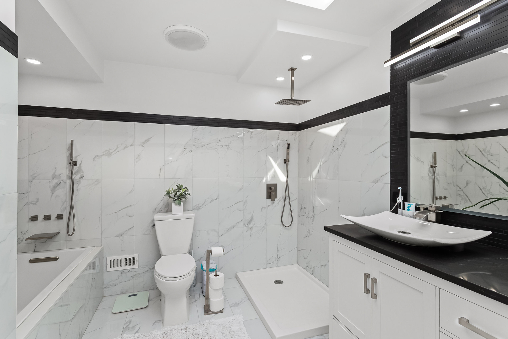 1585 West Oakmont Road Hoffman Estates, IL 60169 - Photo 11 of 25 a bathroom with a sink a toilet and shower