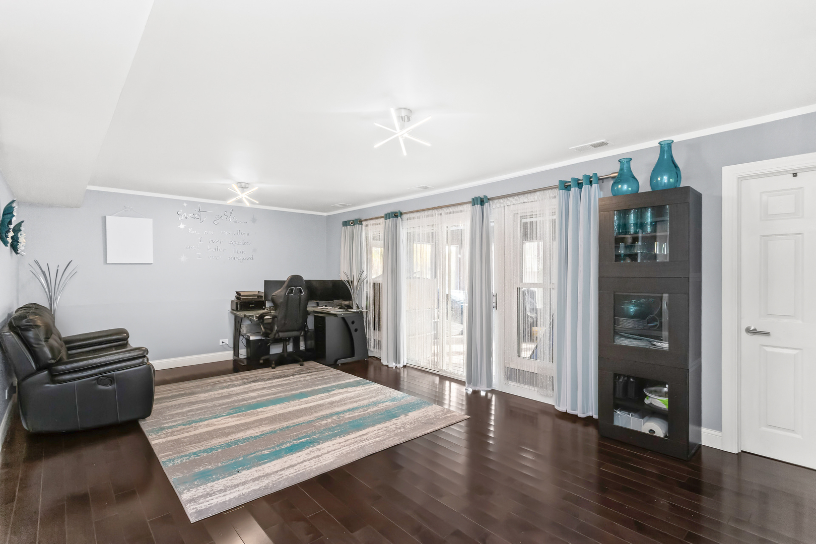 1585 West Oakmont Road Hoffman Estates, IL 60169 - Photo 15 of 25 a bedroom with furniture and wooden floor