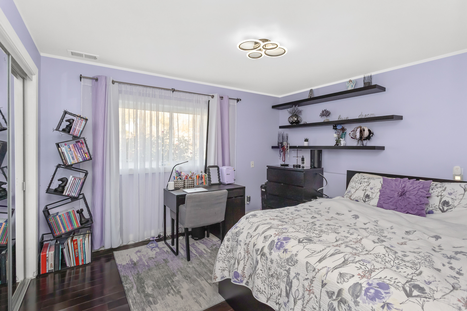 1585 West Oakmont Road Hoffman Estates, IL 60169 - Photo 16 of 25 a bedroom with a bed and a table in it