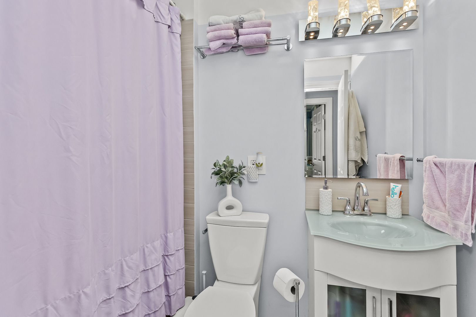 1585 West Oakmont Road Hoffman Estates, IL 60169 - Photo 17 of 25 a bathroom with a granite countertop sink a toilet and a mirror