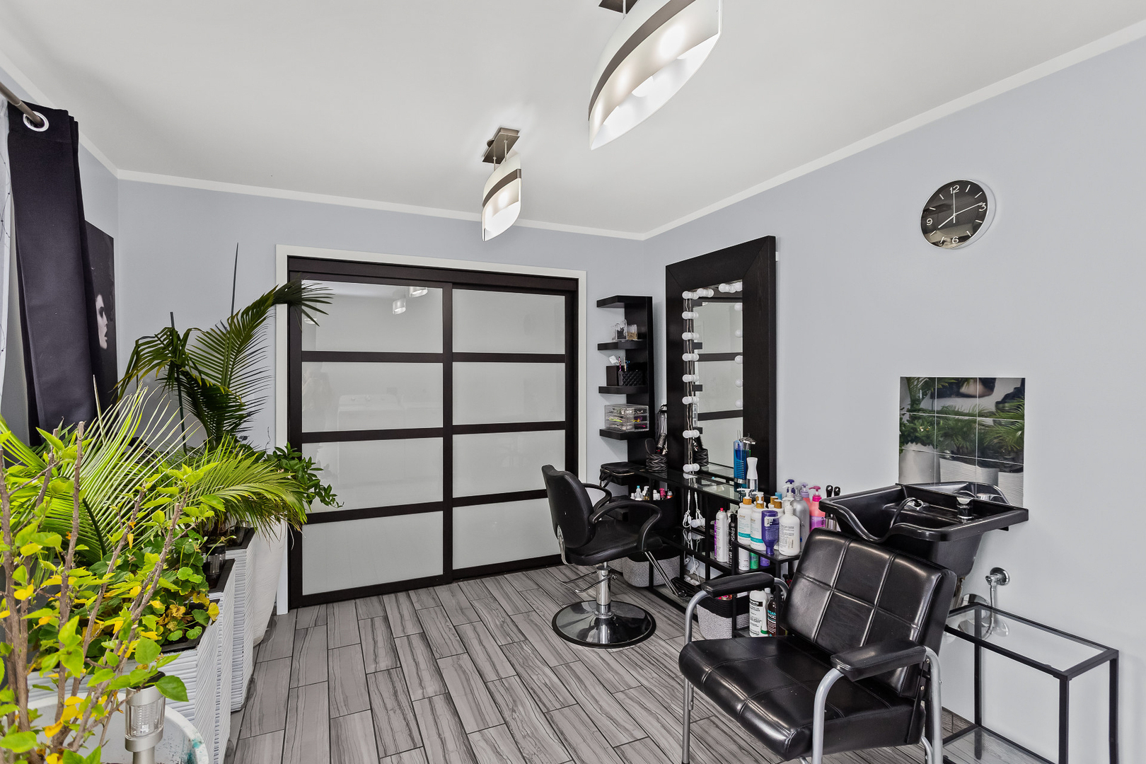 1585 West Oakmont Road Hoffman Estates, IL 60169 - Photo 19 of 25 a view of a workspace with furniture and a potted plant