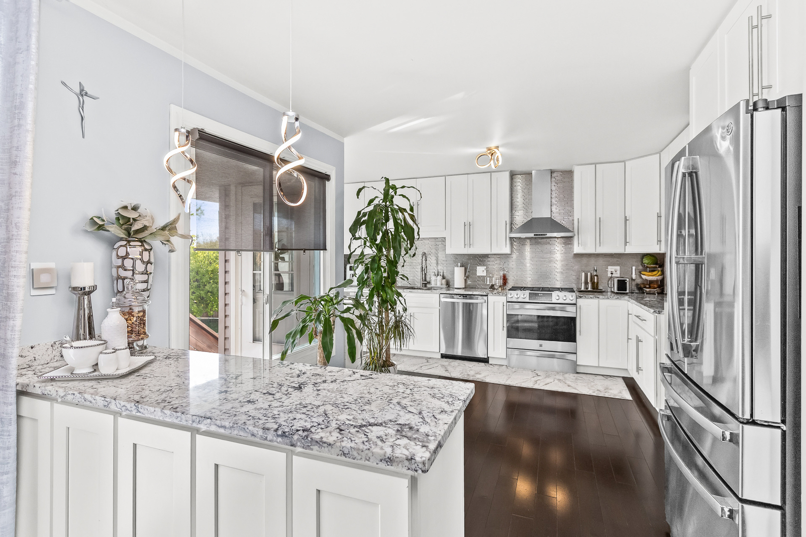 1585 West Oakmont Road Hoffman Estates, IL 60169 - Photo 2 of 25 a kitchen with stainless steel appliances granite countertop a sink stove and refrigerator