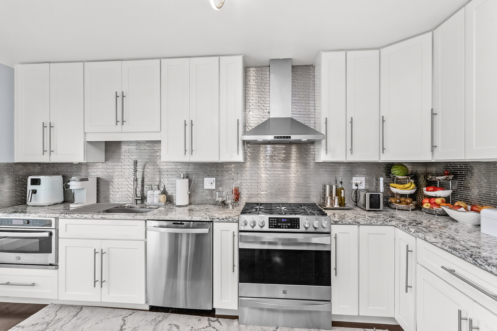 1585 West Oakmont Road Hoffman Estates, IL 60169 - Photo 3 of 25 a kitchen with granite countertop white cabinets and white appliances