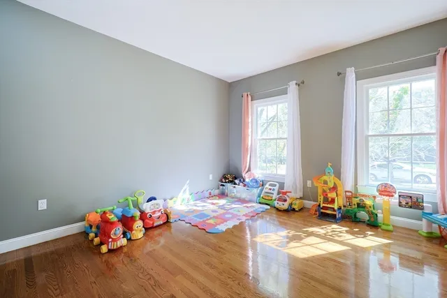 a bedroom with bed and window