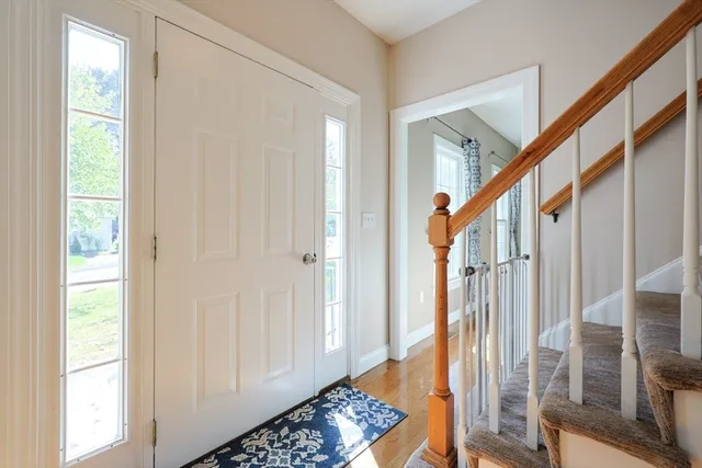 a view of entryway with wooden floor and a rug