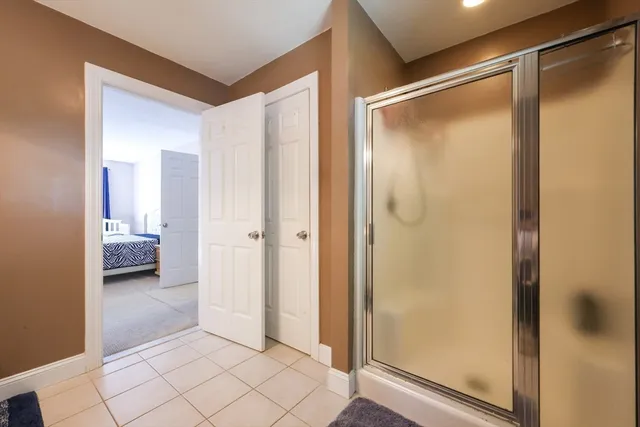 a view of a bathroom with a glass shower door