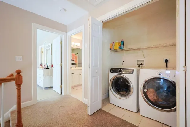 a view of a hallway with washer and dryer