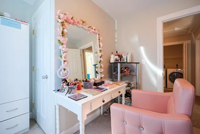 a room with furniture a rug and a mirror