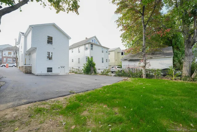 a view of backyard with a garden and plants
