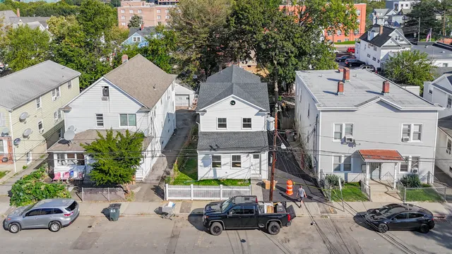 a view of multiple houses with outdoor space