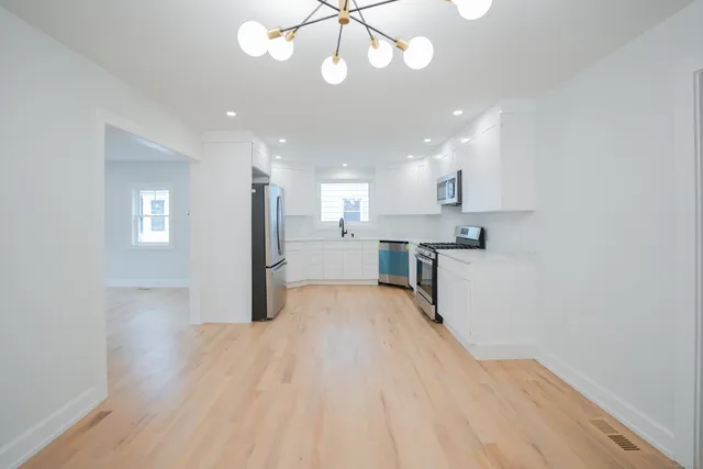 a view of kitchen with wooden floor