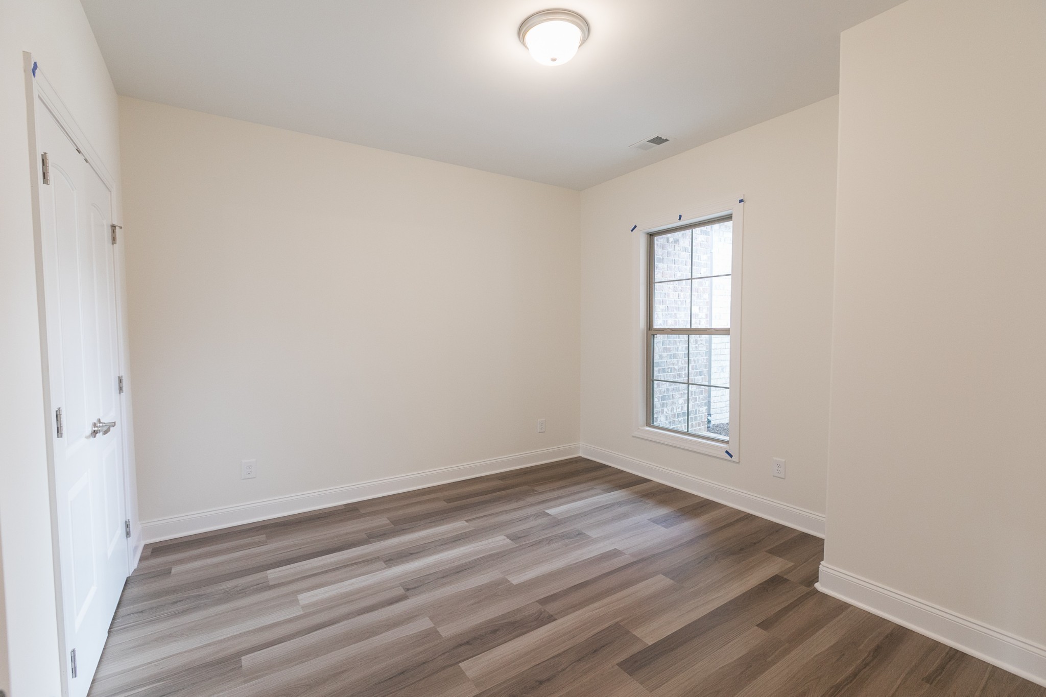 422 West Foxrun Springfield, TN 37172 - Photo 14 of 18 an empty room with wooden floor and windows