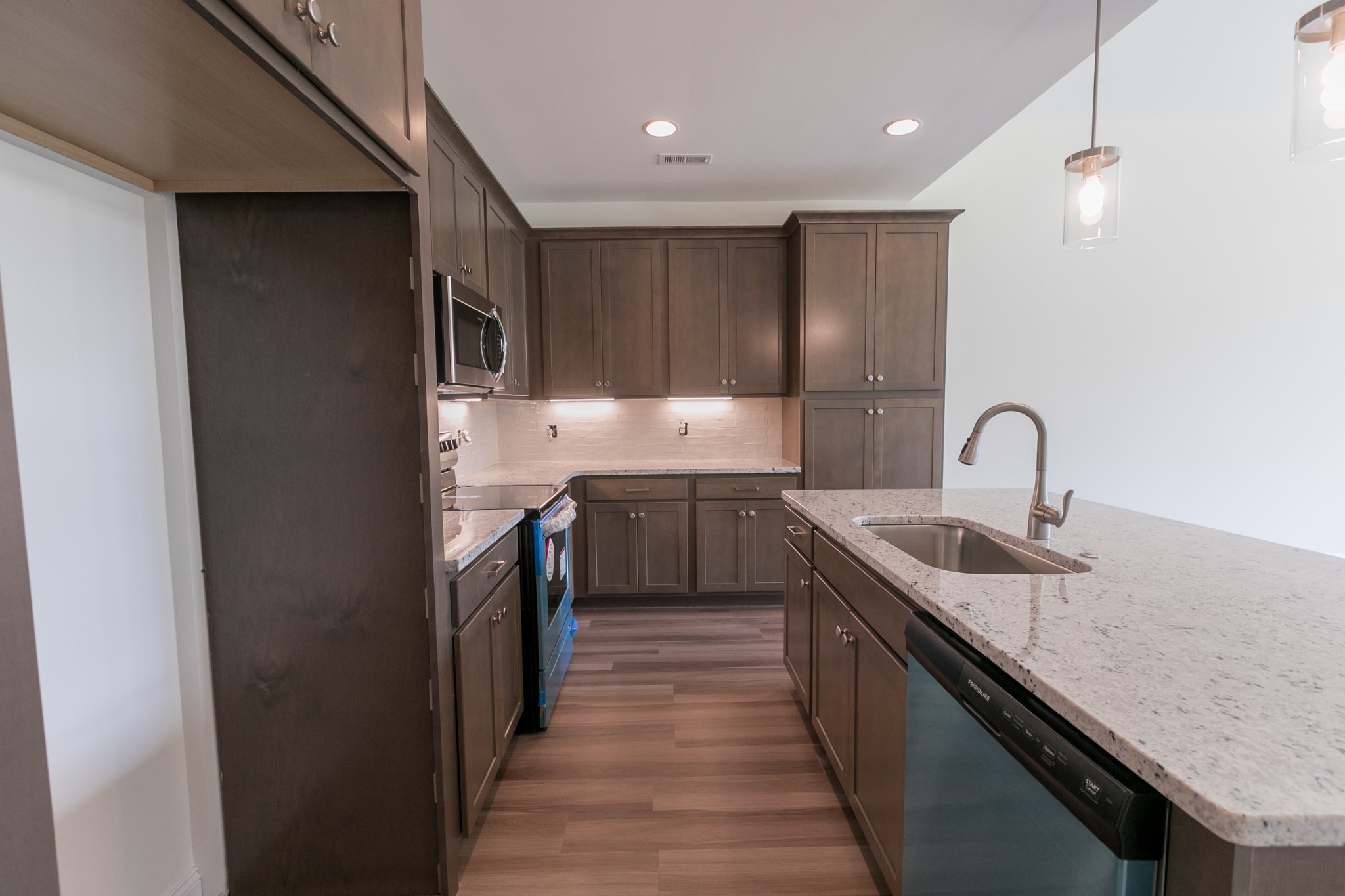 422 West Foxrun Springfield, TN 37172 - Photo 8 of 18 a kitchen with kitchen island a sink stainless steel appliances and cabinets