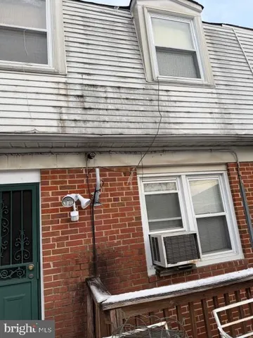 a view of a brick house with a window