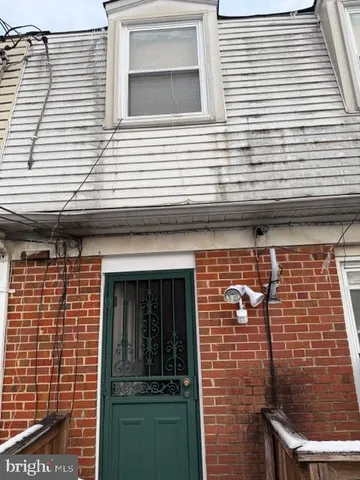 a view of a backyard with sitting area
