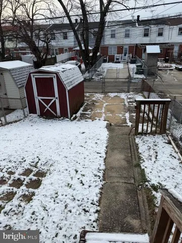 a roof deck with table and chairs