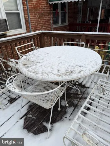 a view of roof deck with patio
