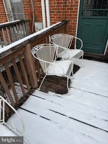 a view of a patio with chair and front door