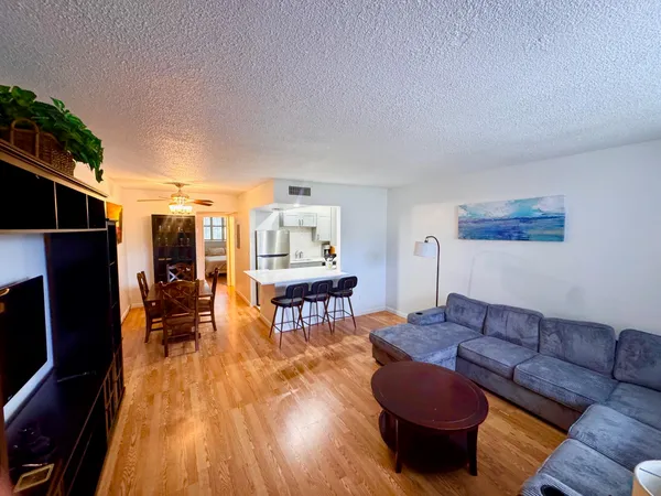 a living room with a fireplace and a table