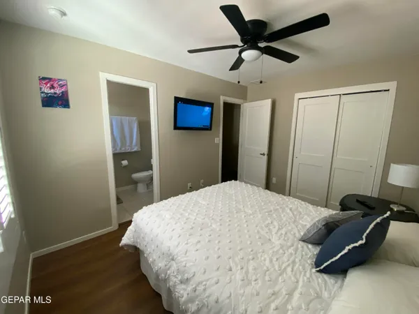 a bedroom with a bed and a view of bathroom