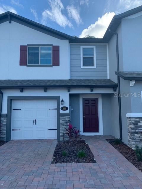 295 Rustic Loop Sanford, FL 32771 - Photo 1 of 1 a front view of a house with a yard