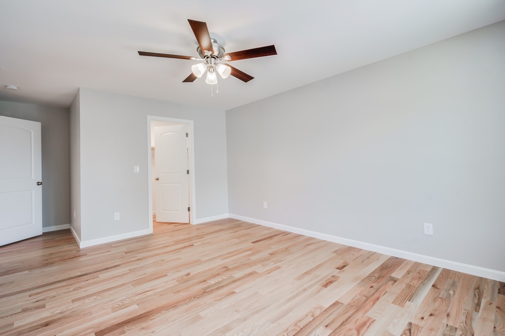 27 Jennings Street Springfield, MA 01119 - Photo 15 of 32 a view of an empty room with wooden floor