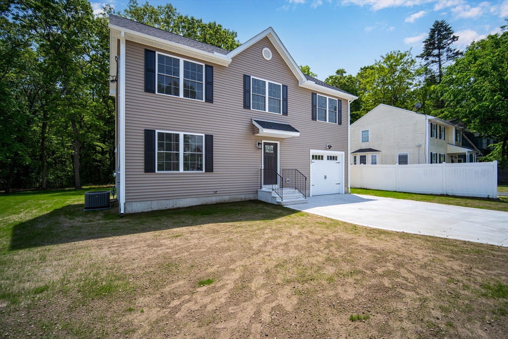 27 Jennings Street Springfield, MA 01119 - Photo 2 of 32 a view of an house with backyard and trees
