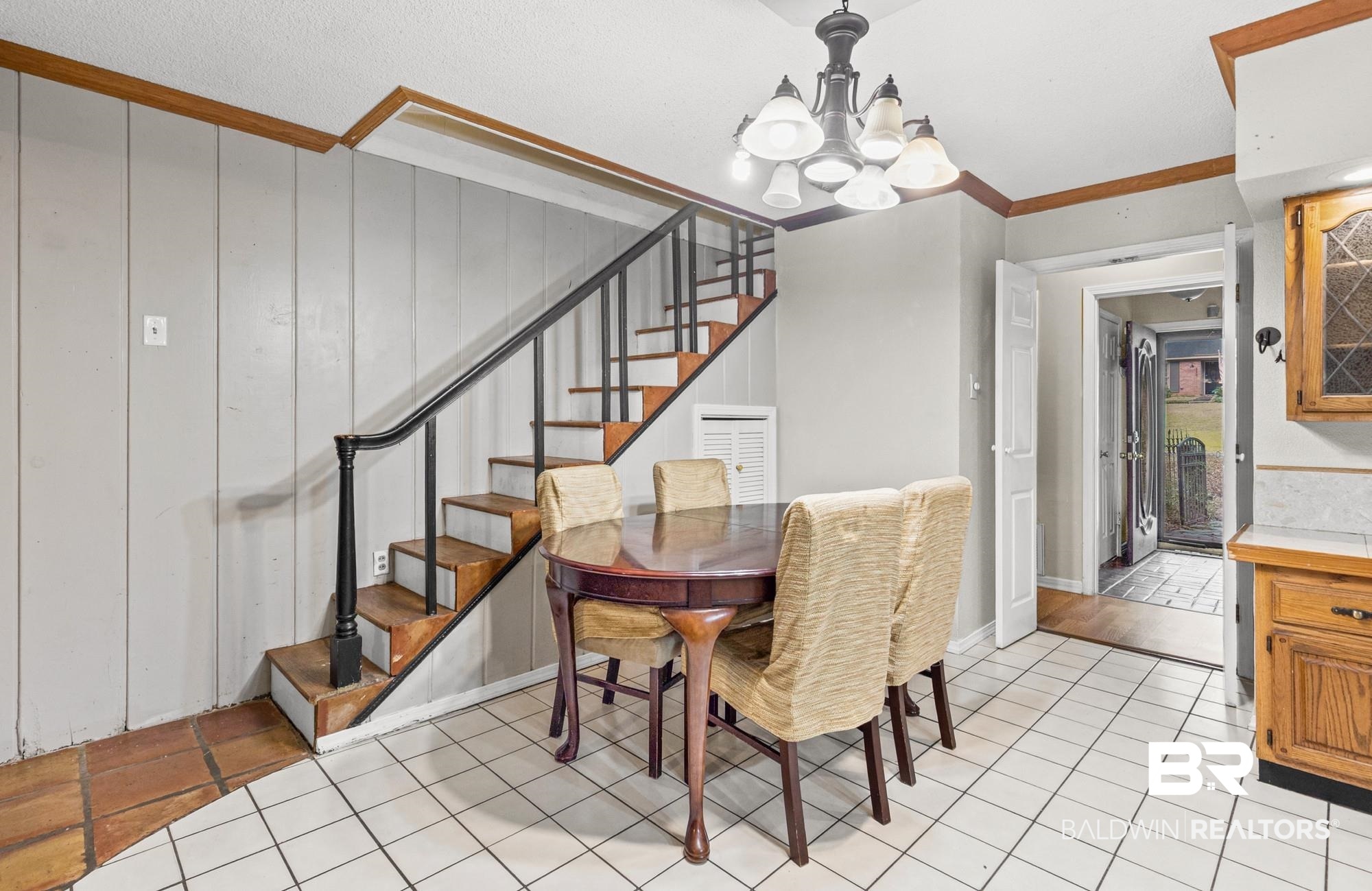 5510 Richmond Road Mobile, AL 36608 - Photo 6 of 21 Staircase featuring dark wood treads and a black handrail