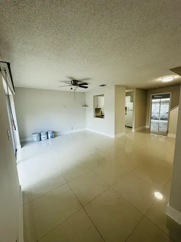 a view of a livingroom with wooden furniture