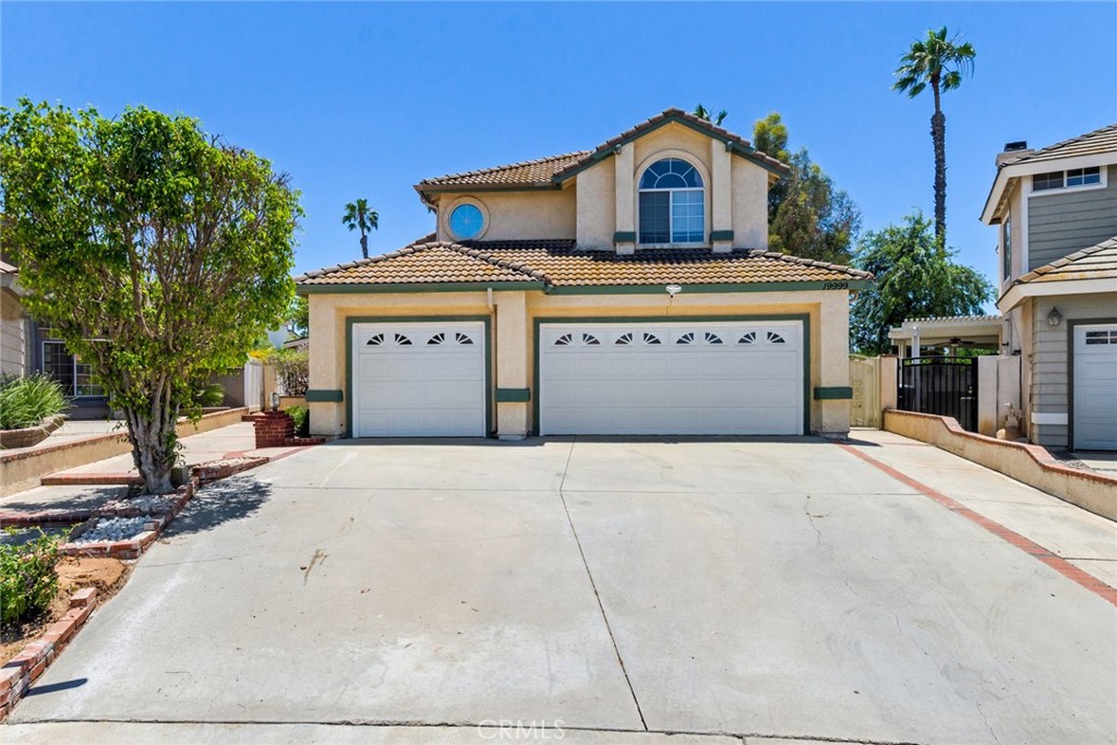 19999 Westerly Drive Riverside, CA 92508 - Photo 1 of 1 a front view of a house with a yard and garage