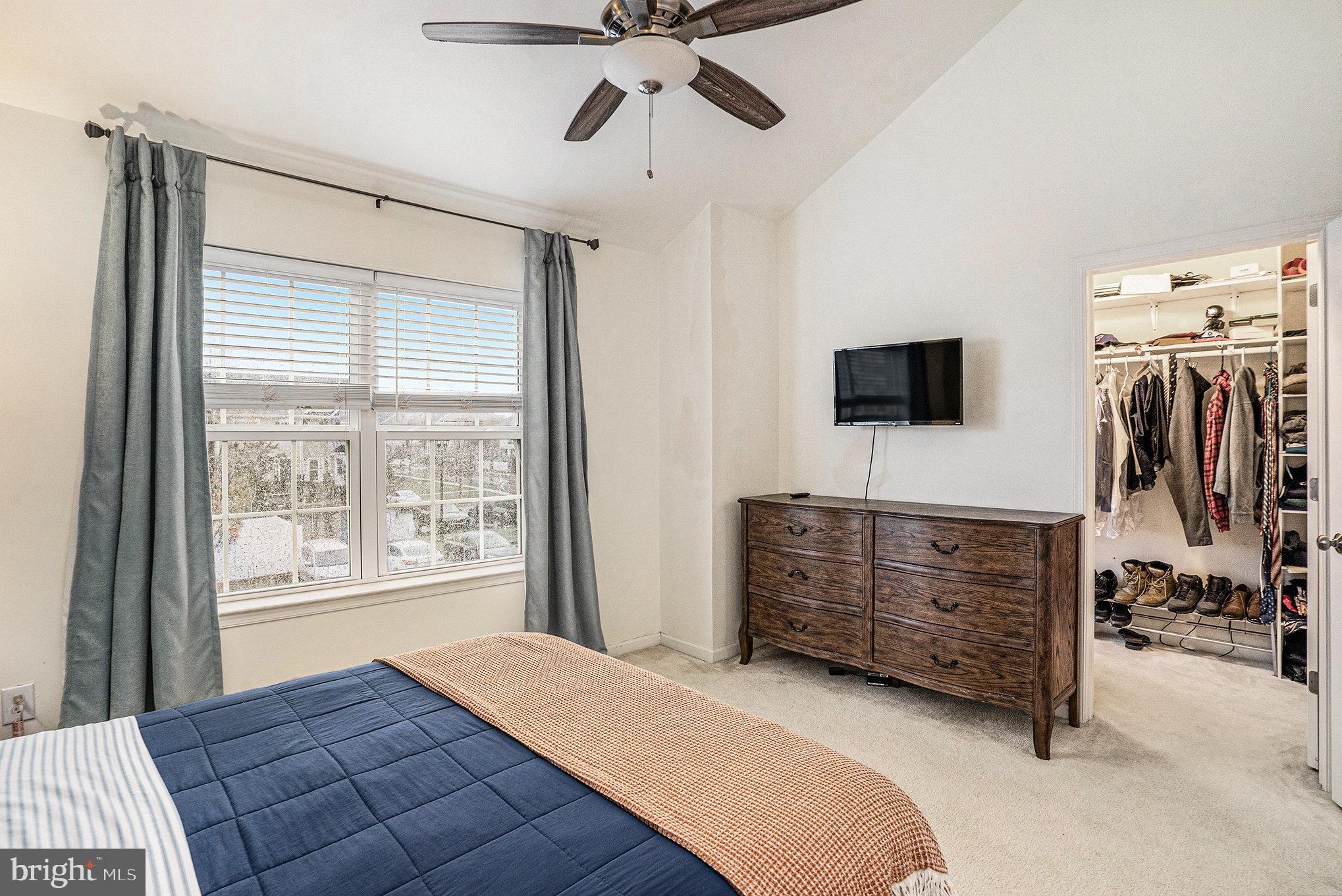 3611 Jacob Stout Road, Unit 8 Doylestown, PA 18902 - Photo 19 of 39 a bed room with furniture and flat screen tv