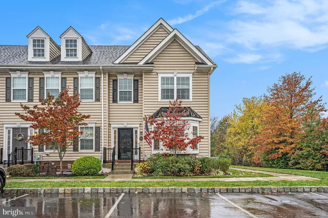 a kitchen with stainless steel appliances granite countertop a sink refrigerator and microwave