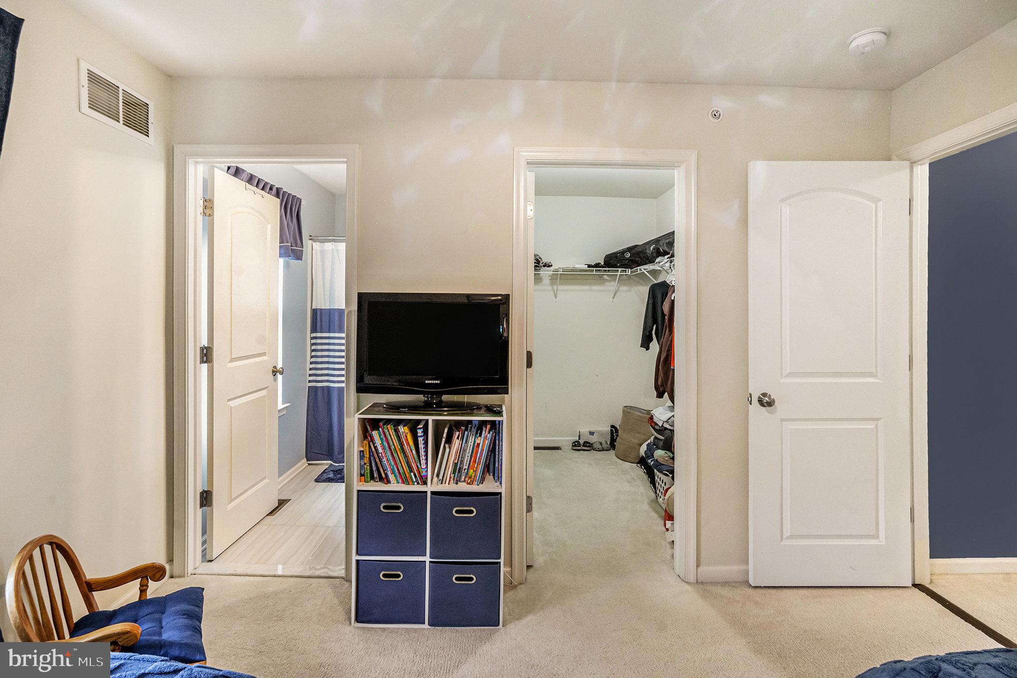3611 Jacob Stout Road, Unit 8 Doylestown, PA 18902 - Photo 24 of 39 a view of a livingroom with furniture and a flat screen tv